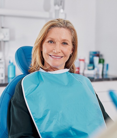 Happy, smiling middle-aged dental patient