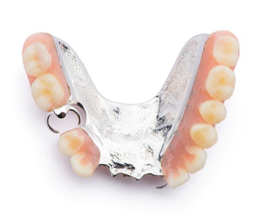 Full set of dentures against dark background