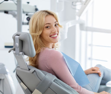 Lady smiling from dental chair