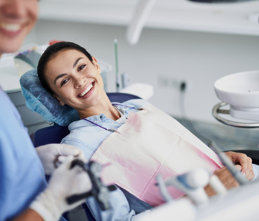 Teeth whitening patient in Worcester talking to dentist