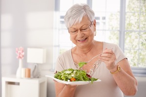 Senior woman about to eat a salad